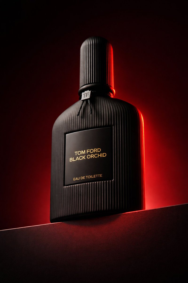 Source image for the AI video “Black Perfume Bottle Low Angle Red Rim Light”