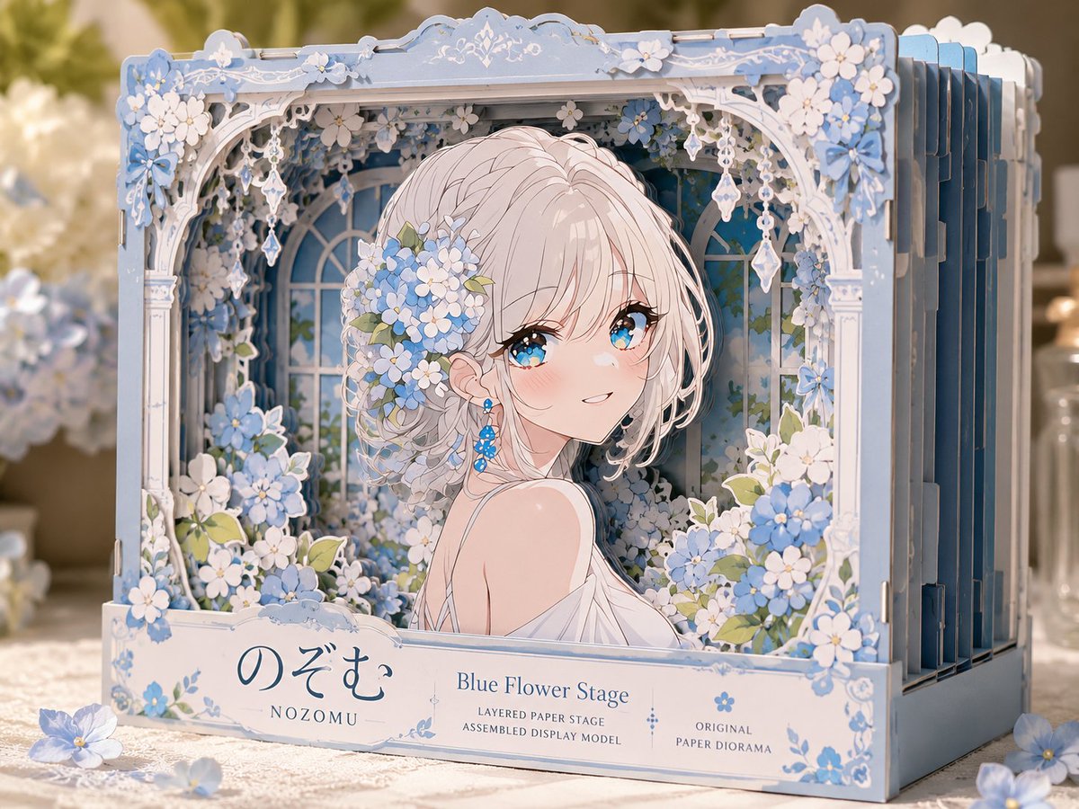 A three-dimensional paper theater shown as a finished craft sample, with the character standing at the center of a horizontal box-stage. Thin layers of paper…